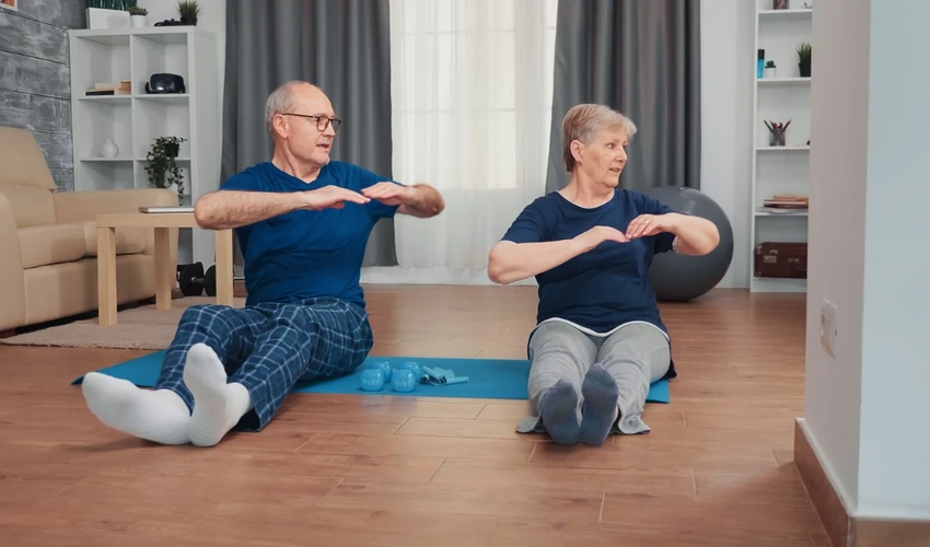 Older adults performing seated balance exercises at home