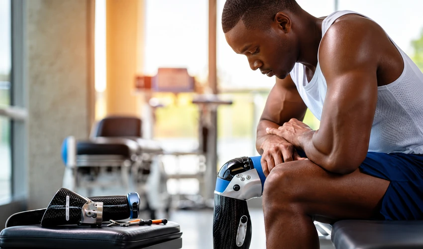 Man resting during a gym recovery session after strength training