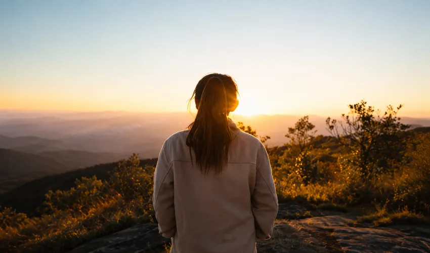 Person outdoors at sunrise during a spring morning
